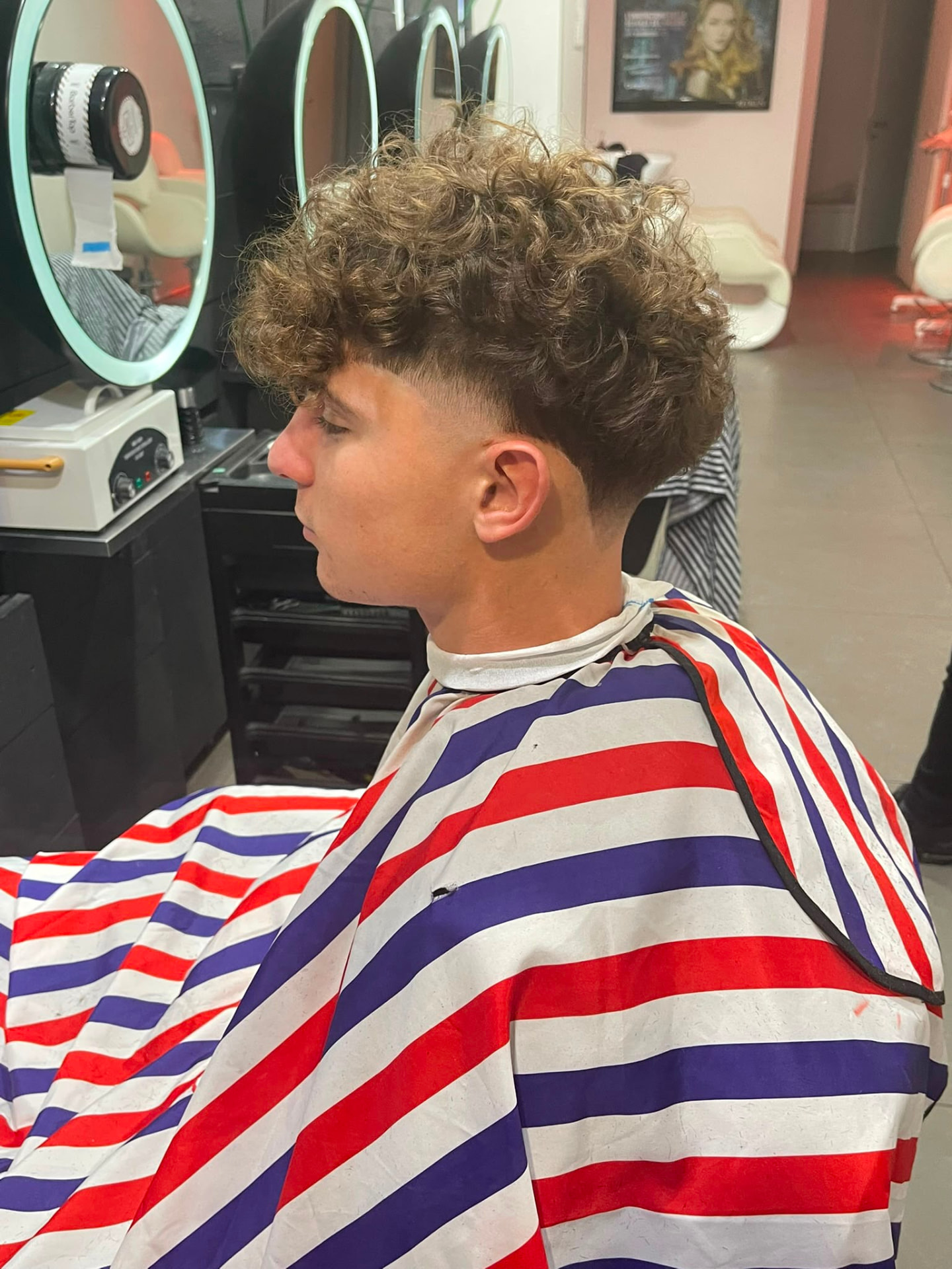 Curly top with low taper fade